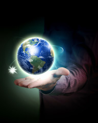Human hand holding earth