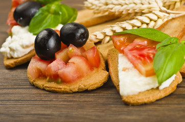 Delicious bruschetta appetizer on wood