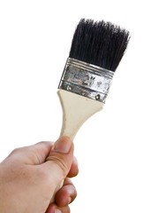 Paintbrush in hand isolated on white background