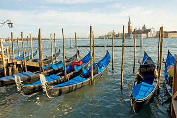 Fototapeta na wymiar Italy, Venice gondola parking at sunset