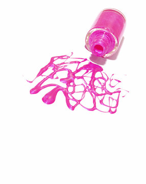 Spilled ,pink nail polish isolated on white background