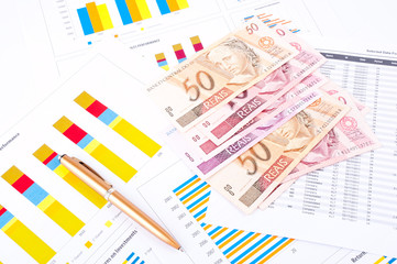 financial chart, Brazilian money and pen