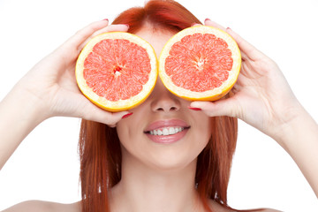 red woman holding grapefruit