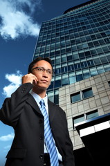 Businessman posing in front of a modern building