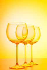 Wine glasses against gradient background
