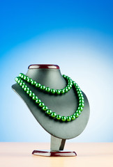 Pearl necklace against gradient background