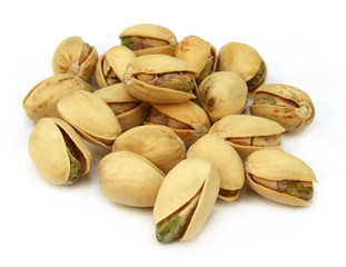 Pistachios over white background
