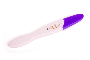 Positive pregnancy test over the white background