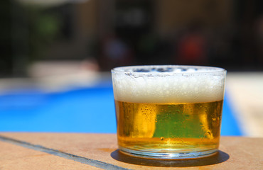 Cold beer in a swimming pool