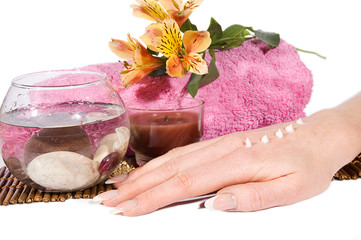Hand with manicure and cream