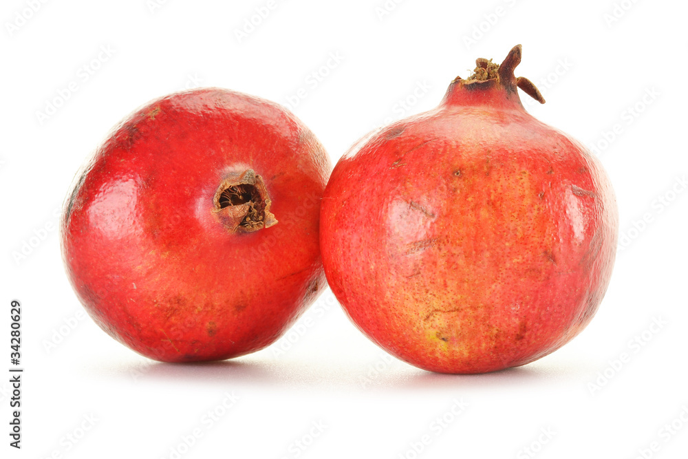 Wall mural two pomegranates isolated on white