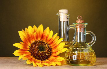 sunflower oil and sunflower on yellow background