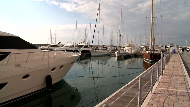 Motorboat and yachts harbored in the marina