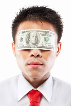 Bribe concept, eyes sealed with dollar bill