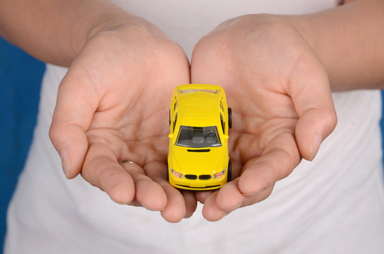Toy car in hand