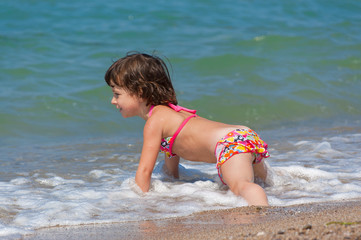 Beach vacation. Happy child in the sea