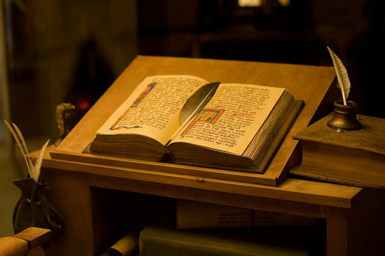 Table with the ancient book. vintage