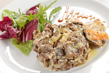 Fricassee with seafood and salad