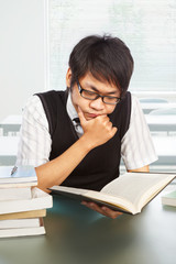 Chinese college male student studying