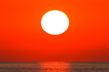 Panele Szklane Podświetlane  wschód słońca na morzu