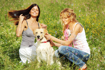 Fototapeta premium girlfriends and dog
