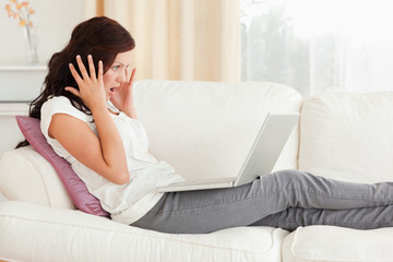 Fototapeta premium Amazed woman with a notebook