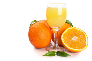 Orange juice in glass and fruits