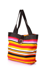 bright striped beach bag isolated on white