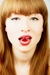 Fototapeta premium woman with a candy in her mouth