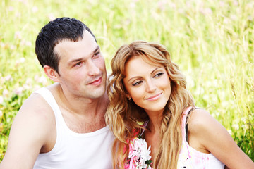 Fototapeta premium lovers on grass field