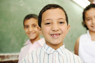 happy children in school, classroom, board