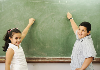 happy children in school, classroom, board