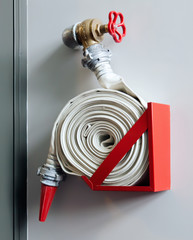 Fire-hose on the wall in a modern building