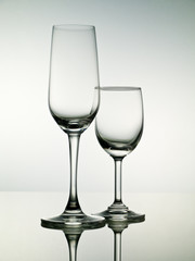 Two empty stemmed glasses