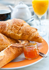 Breakfast with coffee and croissants