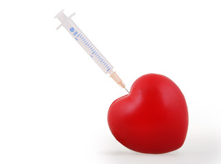 Syringe injecting a red heart