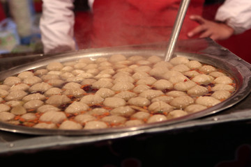 meatballs in bubbling bouillon