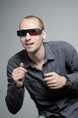 Fototapeta premium excited man watching movie with 3d glasses