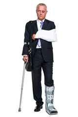 Injred businessman on crutches isolated on white