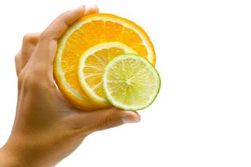 Orange, lemon and lime in the hand on the white