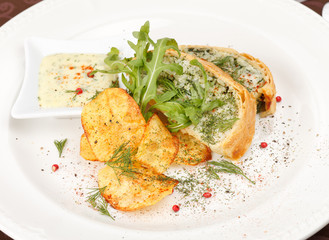 fish pie with sauce and potato chips