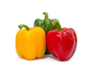 Three sweet peppers in yellow, red and green color