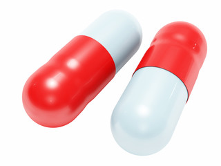 Two shiny white-blue medical pills isolated
