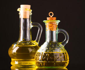 olive oil in jars on black background