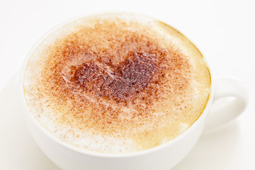 cappuccino in a cup in the shape of hearts isolated on white