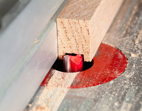 Macro Shot Of Router Bit Cutting Into Wood