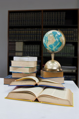 Pile of books and globe
