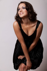 Sensual young brunette woman with makeup smoky eyes