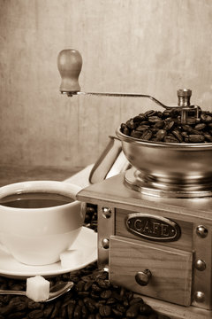 cup of coffee, beans and grinder