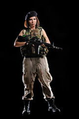 Fototapeta premium woman in military uniform with weapon